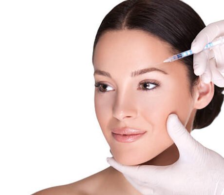 close up of cosmetic injection of botox in the wrinkles on the forehead